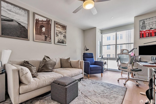 989 Sutter St Unit 2, San Francisco, CA 94109 - living area with wood finished floors, ceiling fan, and a desk