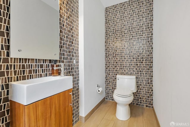 989 Sutter St Unit 2, San Francisco, CA 94109 - bathroom featuring tile walls, toilet, vanity, and tile patterned flooring