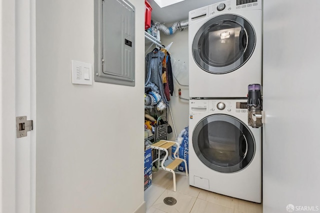989 Sutter St Unit 2, San Francisco, CA 94109 - laundry area featuring stacked washer / dryer, electric panel, and tile patterned floors