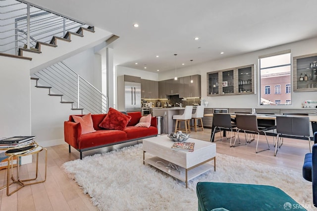 989 Sutter St Unit 2, San Francisco, CA 94109 - living room with light wood finished floors, stairs, and recessed lighting