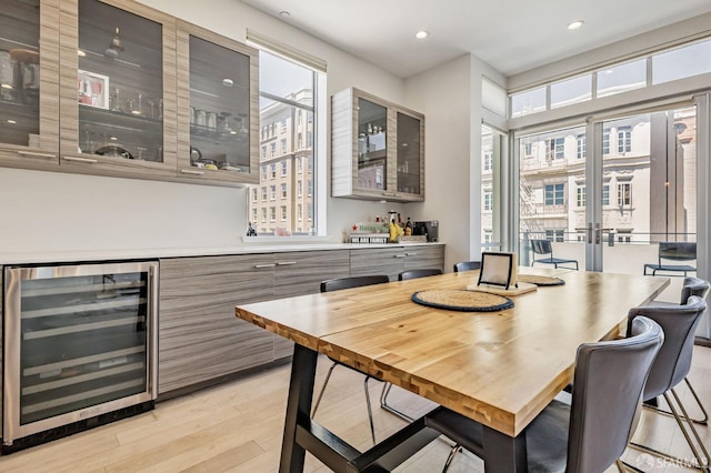 989 Sutter St Unit 2, San Francisco, CA 94109 - dining space featuring beverage cooler, a dry bar, light wood-style floors, and recessed lighting