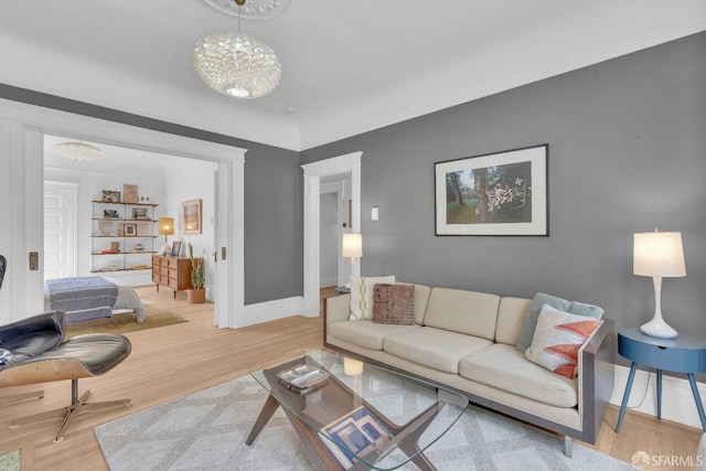 living room with baseboards and wood finished floors