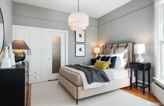 bedroom with light wood-type flooring