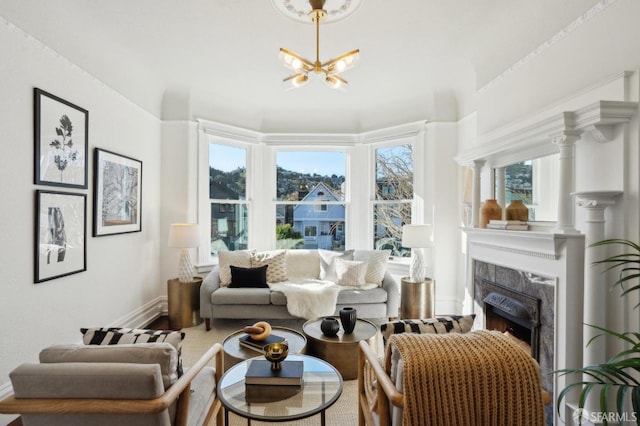 interior space with a notable chandelier, a fireplace, and baseboards