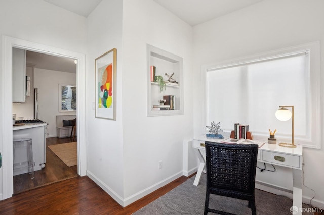 home office with dark wood finished floors and baseboards