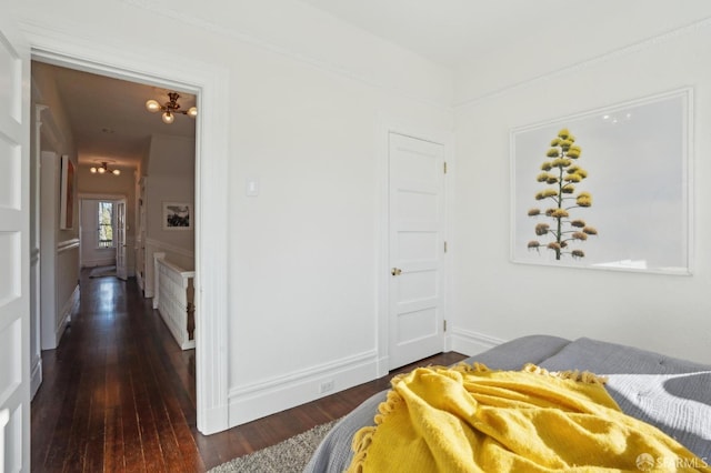 bedroom featuring dark wood-style flooring