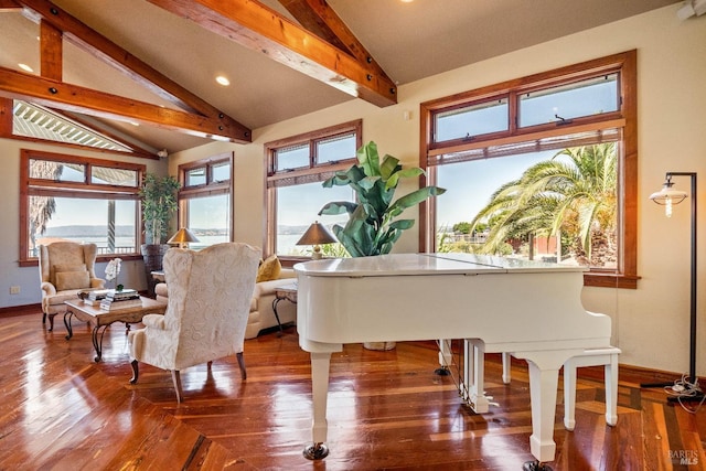 sitting room featuring lofted ceiling with beams and hardwood / wood-style floors