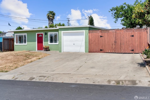 27 Nancy Dr, San Pablo, CA 94806 - view of front of property with stucco siding, an attached garage, and driveway