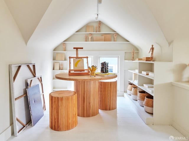 bar with lofted ceiling