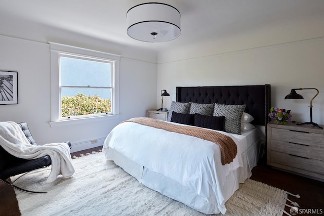 bedroom with wood finished floors