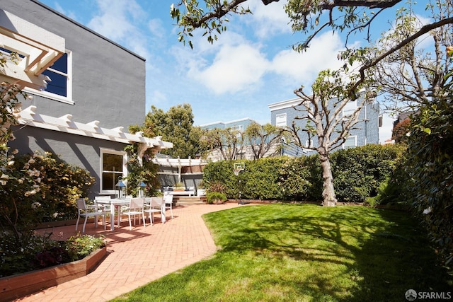 view of yard with a pergola and a patio area
