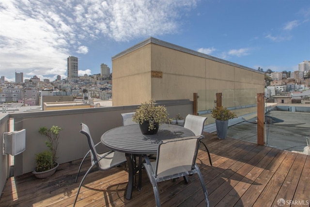 wooden deck with a view of city