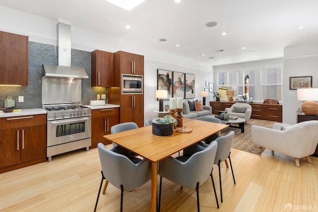 dining room featuring recessed lighting and light wood-style floors