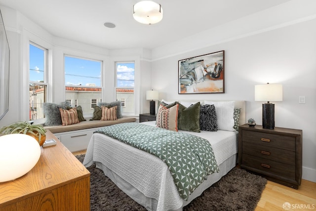 bedroom with light wood-type flooring