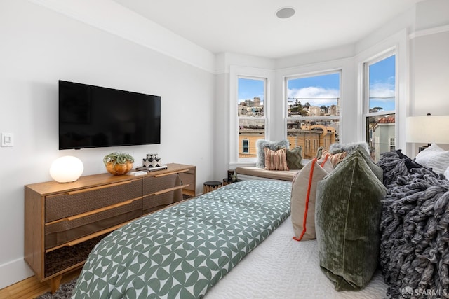 bedroom with wood finished floors