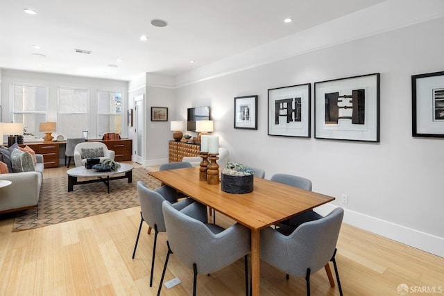 dining space featuring visible vents, recessed lighting, light wood-style floors, and baseboards