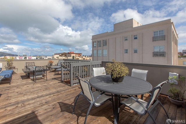 deck with outdoor dining area