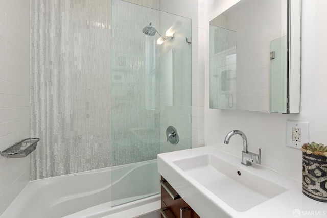 full bath featuring vanity and shower / bathtub combination