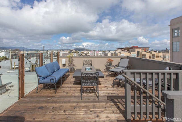 wooden deck with an outdoor living space