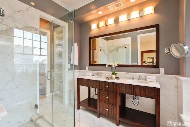 bathroom featuring crown molding, vanity, tile walls, and walk in shower