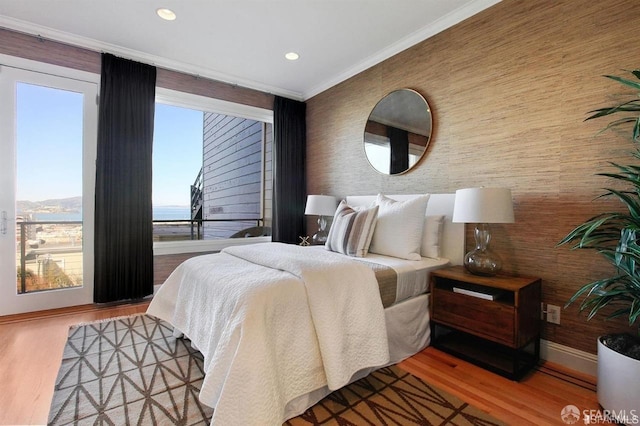 bedroom featuring crown molding and wood-type flooring