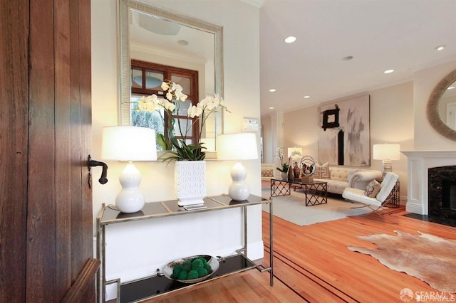 interior space featuring ornamental molding and hardwood / wood-style flooring