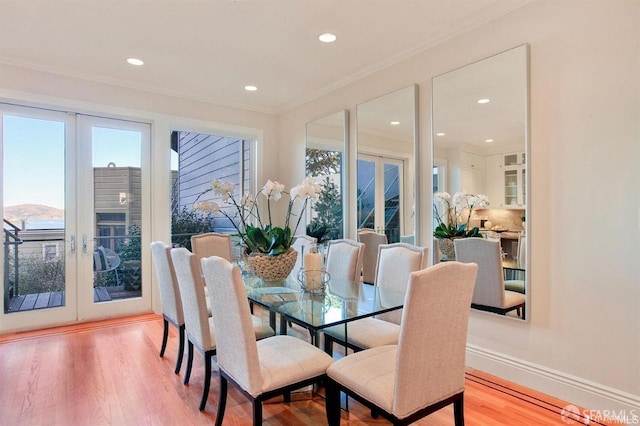 824 Green St, San Francisco, CA 94133 - dining area featuring french doors, light wood finished floors, ornamental molding, and recessed lighting