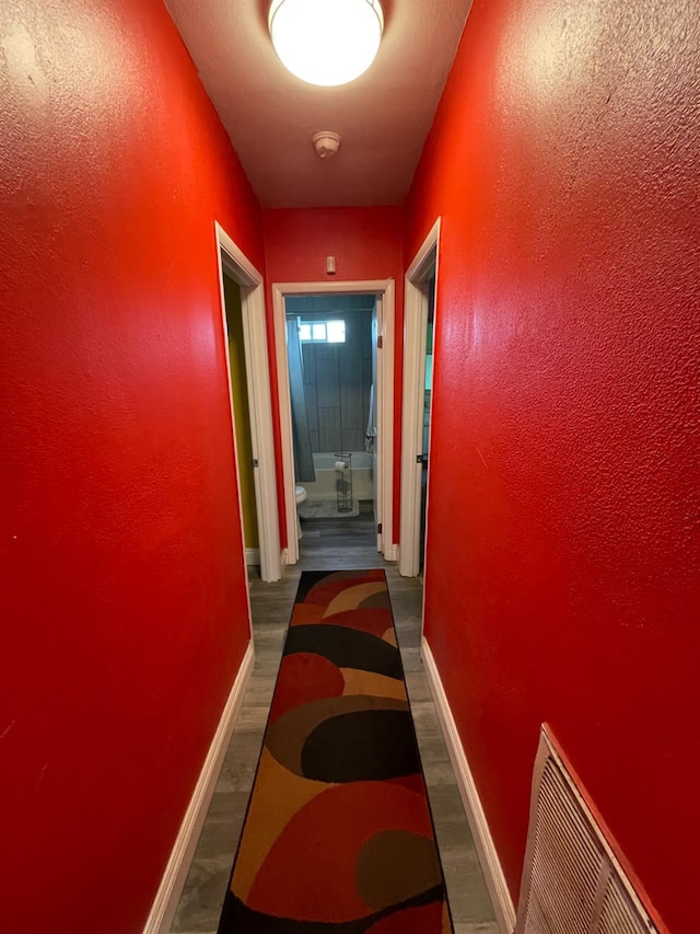 3740 26th Ave, Sacramento, CA 95820 - hallway featuring baseboards and wood finished floors