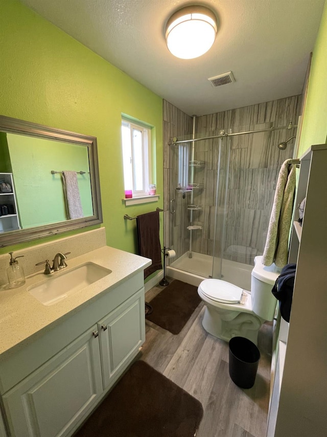 3740 26th Ave, Sacramento, CA 95820 - full bathroom with a stall shower, vanity, wood finished floors, and a textured ceiling