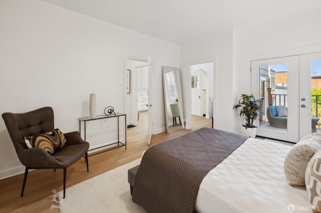 1063-1065 Sanchez St, San Francisco, CA 94114 - bedroom featuring access to outside, light wood-style floors, and french doors