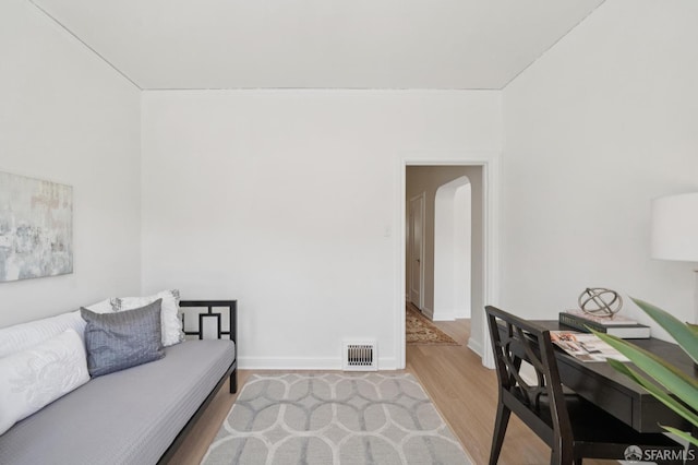 1063-1065 Sanchez St, San Francisco, CA 94114 - living area featuring wood finished floors and arched walkways