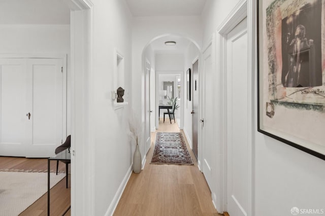 1063-1065 Sanchez St, San Francisco, CA 94114 - hall with light wood-style floors and arched walkways