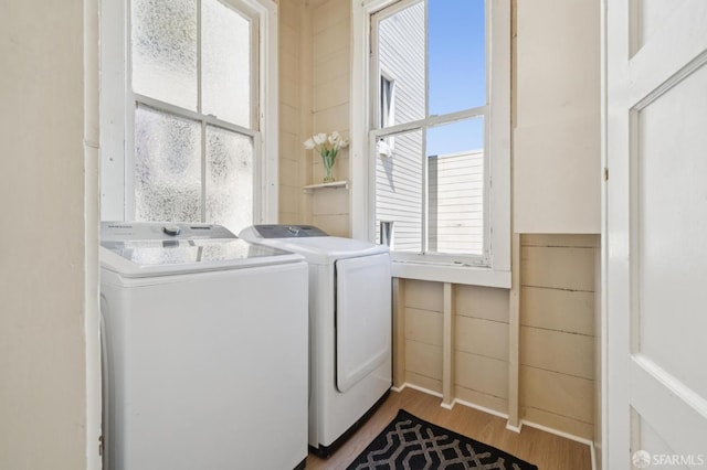 1063-1065 Sanchez St, San Francisco, CA 94114 - laundry room with washer and clothes dryer, wood finished floors, and plenty of natural light