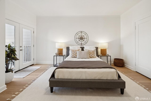 1063-1065 Sanchez St, San Francisco, CA 94114 - bedroom featuring wood finished floors, access to outside, and french doors