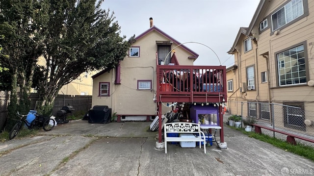 back of property featuring cooling unit