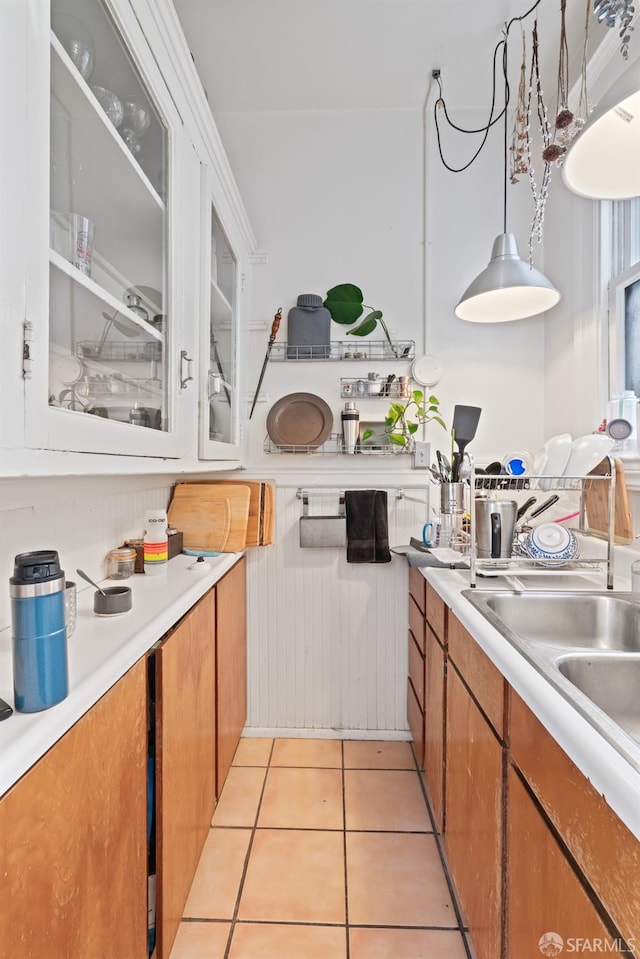 kitchen featuring sink and light tile patterned floors