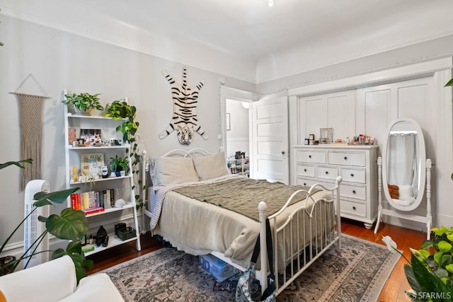 bedroom featuring dark hardwood / wood-style floors