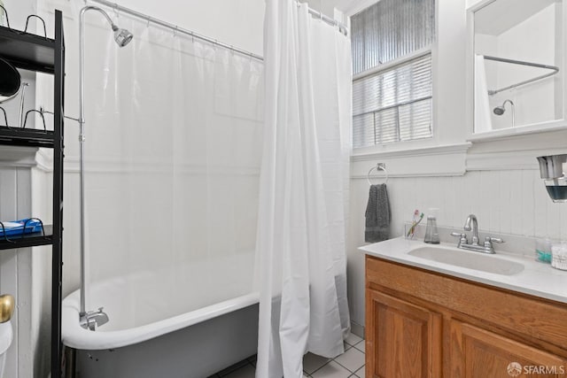 bathroom with shower / bathtub combination with curtain, tile patterned floors, and vanity