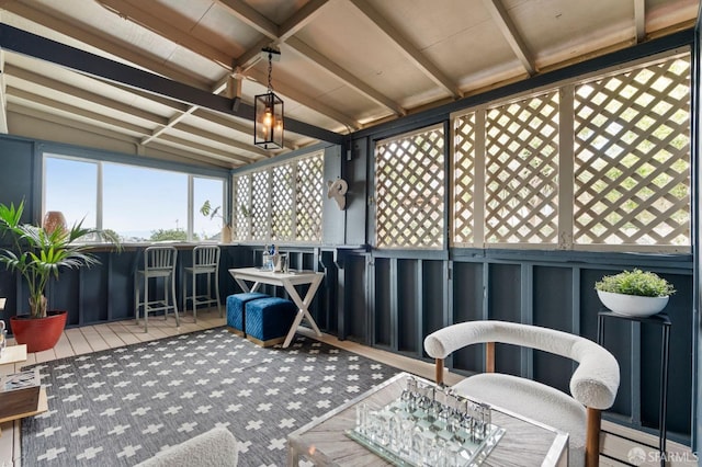 sunroom featuring a wealth of natural light and outdoor dry bar