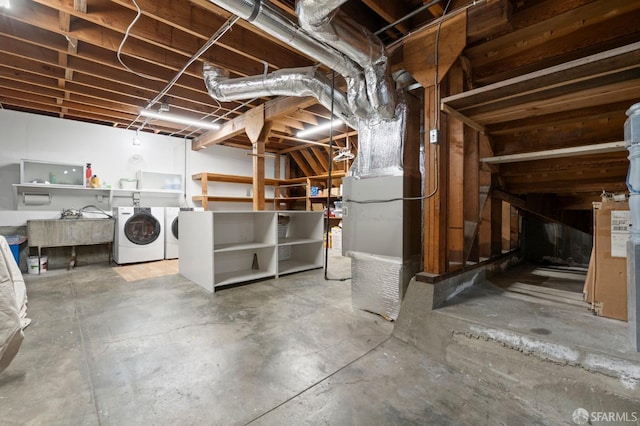 unfinished below grade area featuring separate washer and dryer
