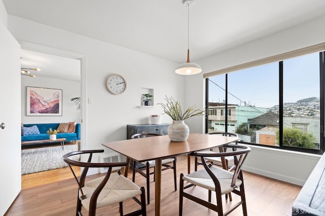 dining room featuring light wood-style flooring