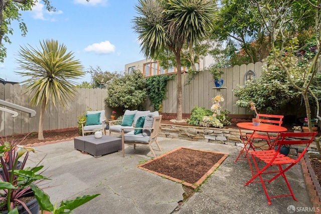 view of patio with outdoor lounge area and a fenced backyard