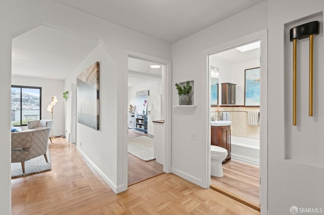 hallway featuring baseboards
