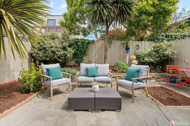 view of patio / terrace featuring an outdoor hangout area and a fenced backyard