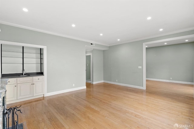 unfurnished living room featuring recessed lighting, baseboards, and light wood finished floors