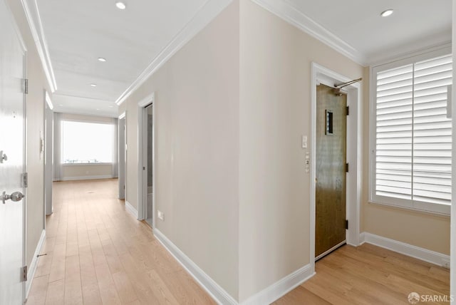 hall featuring ornamental molding, recessed lighting, light wood-style flooring, and baseboards