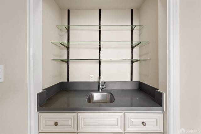 bar featuring a sink