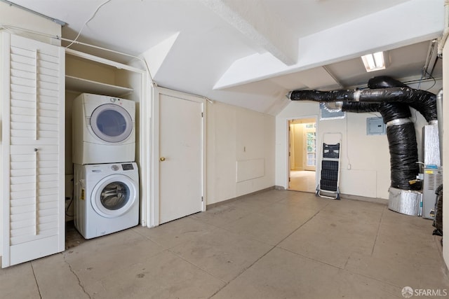 clothes washing area with laundry area and stacked washer / drying machine