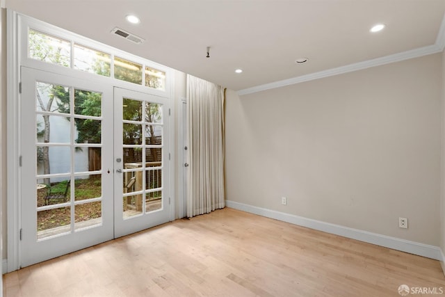 doorway to outside featuring visible vents, wood finished floors, crown molding, french doors, and recessed lighting
