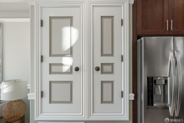 interior space with stainless steel fridge with ice dispenser